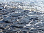 FZ011805 Small waves over rocks on Llantwit Major beach.jpg